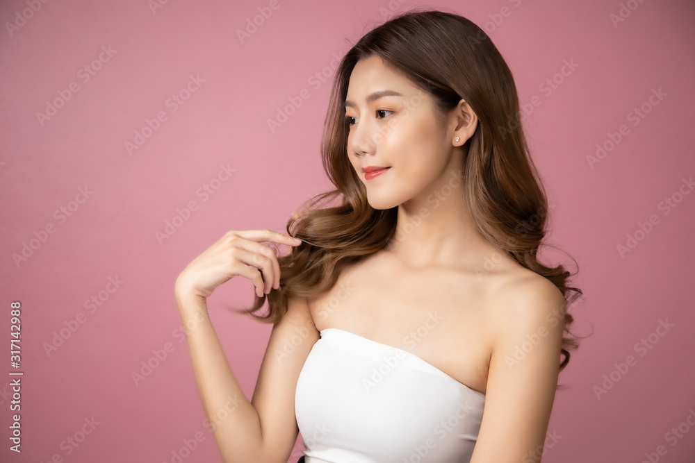 Beautiful Young Asian Woman short hair with Clean Fresh Skin. Face care, Facial treatment, Cosmetology, beauty and healthy skin and cosmetic ideas concept.pretty woman holding half of orange . Beautiful Young Asian Woman short hair with Clean Fresh Skin. Face care, Facial treatment, Cosmetology, beauty and healthy skin and cosmetic ideas concept.pretty woman holding half of orange .