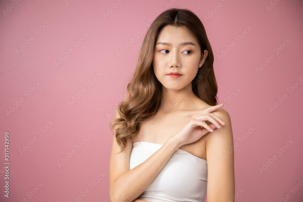 Beautiful Young Asian Woman short hair with Clean Fresh Skin. Face care, Facial treatment, Cosmetology, beauty and healthy skin and cosmetic ideas concept.pretty woman holding half of orange . Beautiful Young Asian Woman short hair with Clean Fresh Skin. Face care, Facial treatment, Cosmetology, beauty and healthy skin and cosmetic ideas concept.pretty woman holding half of orange .