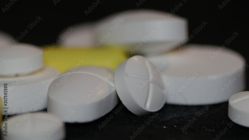 white and yellow pills tablet slider shot 4k white and yellow pills tablet slider shot 4k