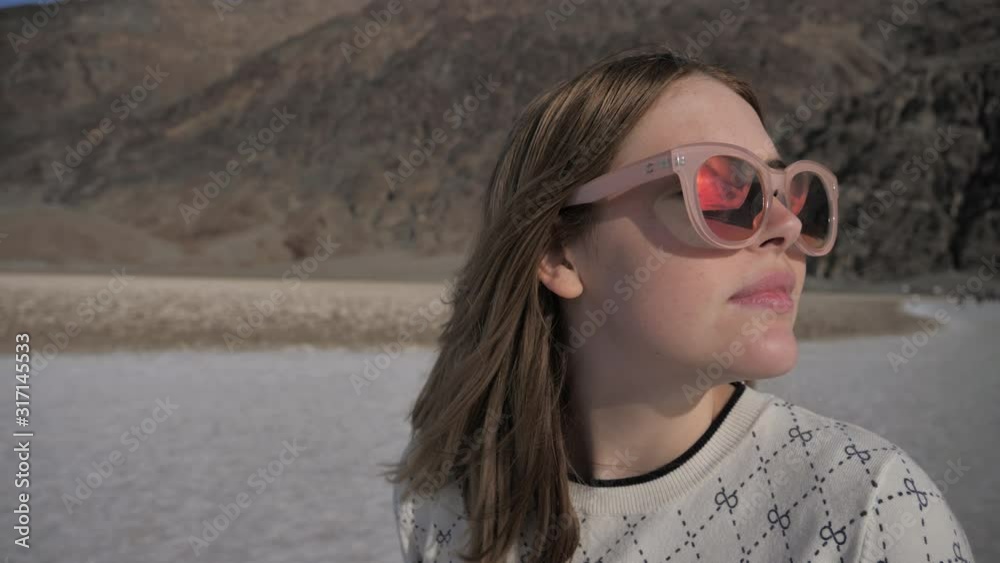 Portrait of fashionable young woman, travel and adventure death valley salt lake Portrait of fashionable young woman, travel and adventure death valley salt lake