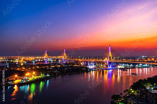Bhumibol suspension bridge over Chao Phraya River at sunset in Bangkok city, Thailand