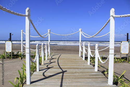  wooden path to the beach shore