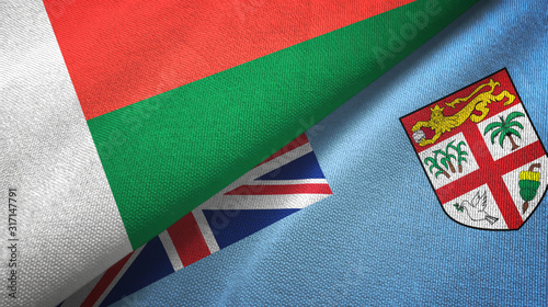 Madagascar and Fiji two flags textile cloth, fabric texture