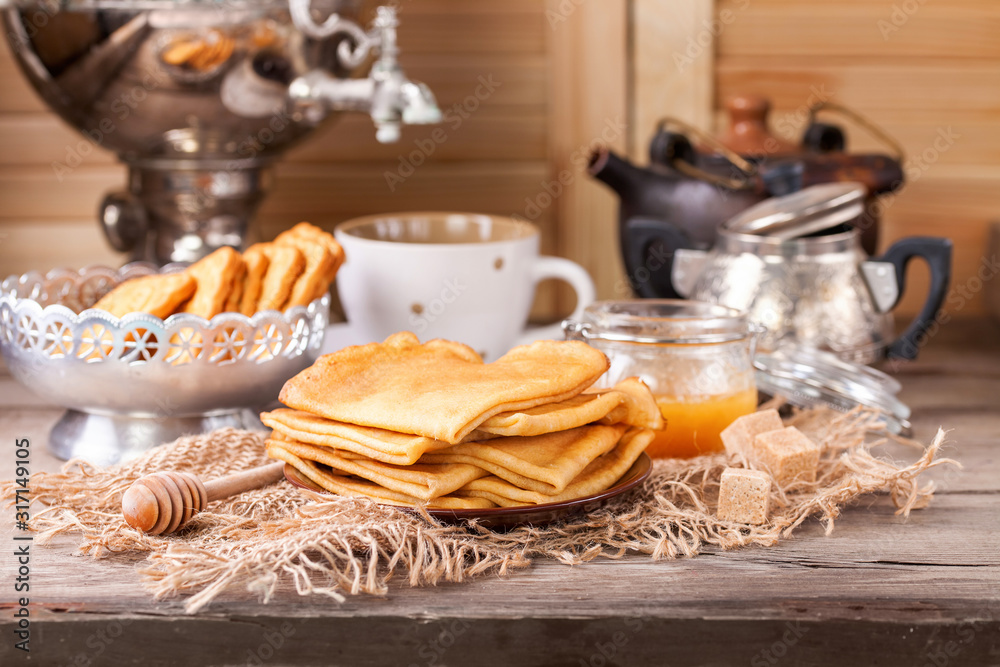 Fototapeta premium Pancakes with honey. Selective focus