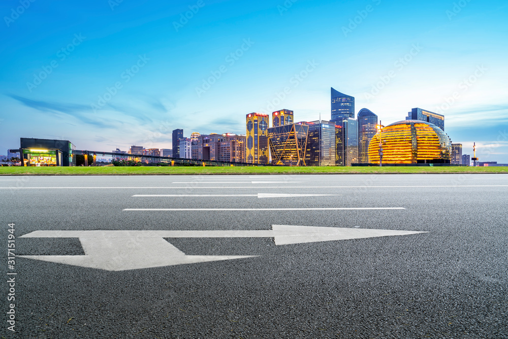Obraz premium Skyline of Asphalt Pavement and Nightscape of Modern Architectural Landscape
