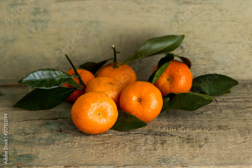Fresh tangerines on an old background.