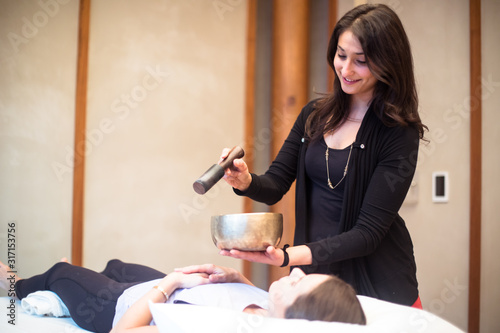 Εκτύπωση καμβά Wellness practitioner with Tibetan singing bowl