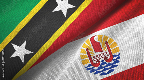 Saint Kitts and Nevis and French Polynesia two flags textile cloth photo