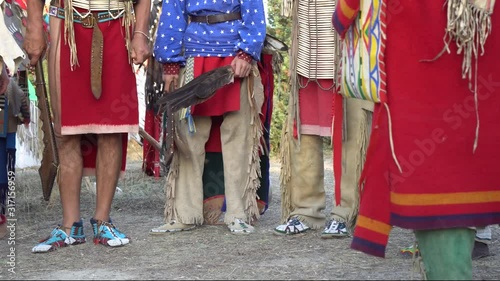 Indian tribe. Men and women. American Indian Crafts. Native American Dance Regalia- Dance Clothes and Accessories, Moccasin and Footwear photo