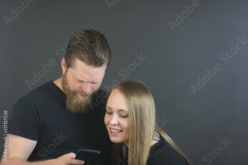 Nosy blonde wife looking at mans phone