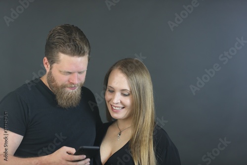 Couple in thirties doing studio photo shoot