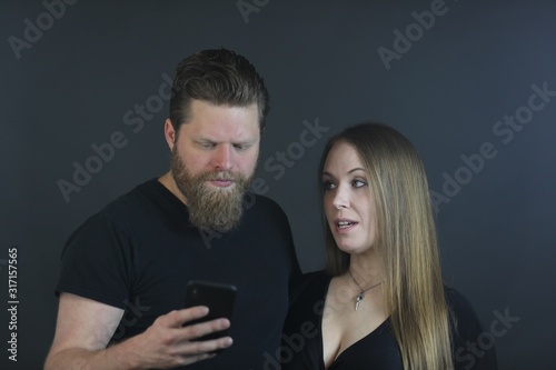 Couple in thirties doing studio photo shoot