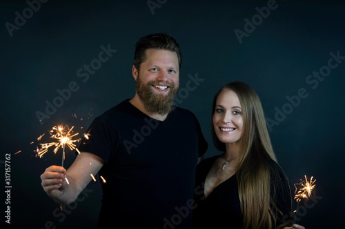 Couple in thirties 4th of july sparklers