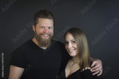 portrait of young, happy couple in studio