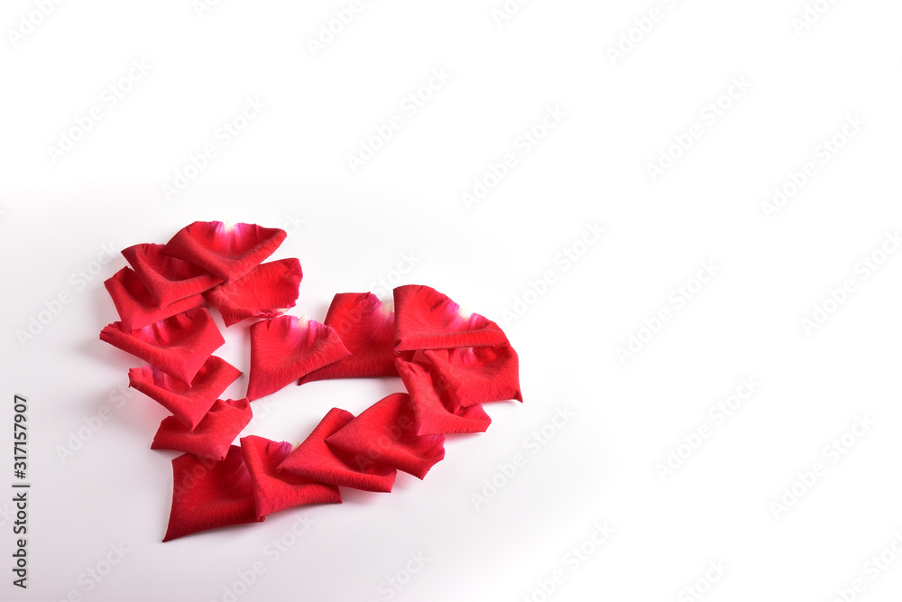 red heart shape of rose petal flower isolated on white background, image romantic love symbol