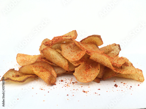 cassava chips are snacks made from cassava slices then fried, then seasoned with a spicy flavor. very suitable for packaging photos because of white background