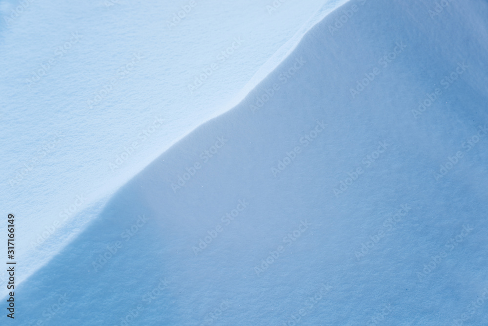 White slope of the snowy mountain, beautiful abstract background. Snowdrift. Winter backdrop concept. Frost winter season White slope of the snowy mountain, beautiful abstract background. Snowdrift. Winter backdrop concept. Frost winter season
