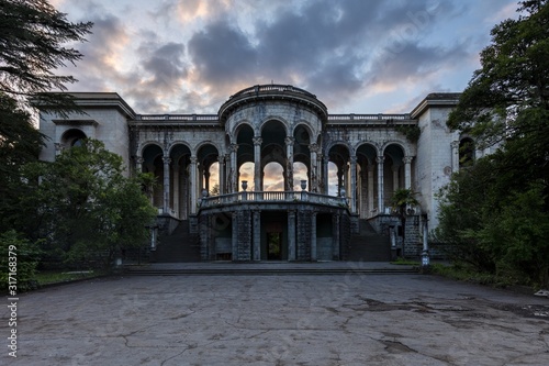Historical Derelict Sanatorium Medea in Tskaltubo, Georgia during the sunset photo