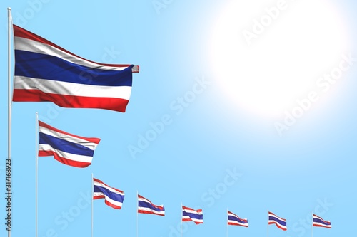 beautiful feast flag 3d illustration. - many Thailand flags placed diagonal on blue sky with space for your text