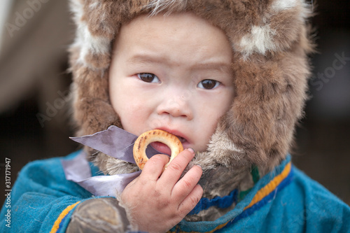 children in the plague  A resident of the tundra  indigenous residents of the Far North  tundra   little girl in the yurt  lack of natural light  selective focus  artistic noise