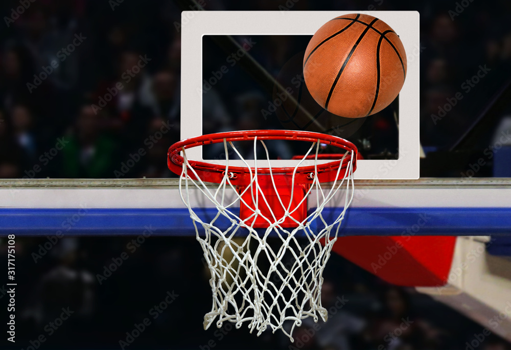 Basketball shot to the hoop in a competitive game in close up Photos |  Adobe Stock