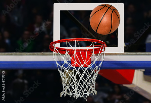 Basketball shot to the hoop in a competitive game in close up