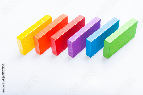 Colorful domino blocks on white background photo