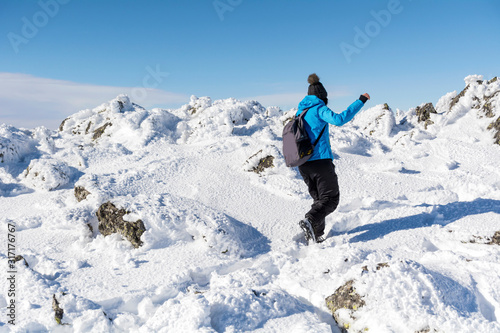 Woman in the High Snowy Mountain .Winter Vacation Concept 