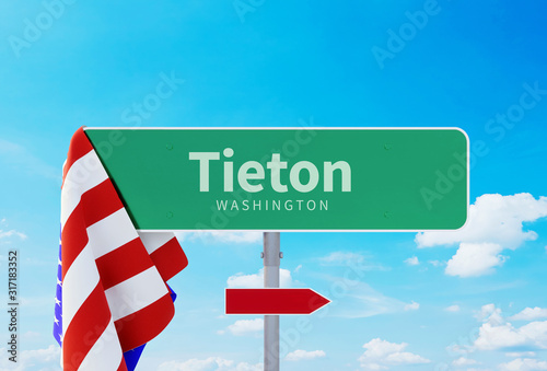 Tieton – Washington. Road or Town Sign. Flag of the united states. Blue Sky. Red arrow shows the direction in the city. 3d rendering photo