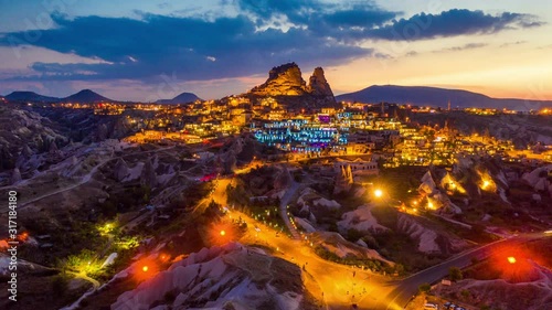 Hyperlapse of Uchisar Castle at twilight in Cappadocia, Turkey. photo