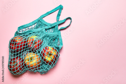 Mesh shopping bag with apples