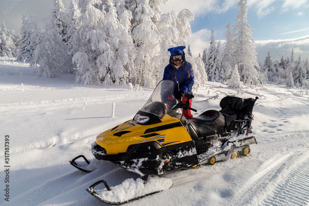 Athlete on a snowmobile.