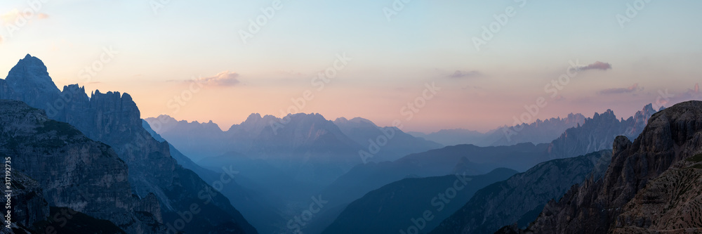 Looking South-East from the Three Peaks in the Dolomite Alps during sunrise, South Tyrol, Italy Looking South-East from the Three Peaks in the Dolomite Alps during sunrise, South Tyrol, Italy