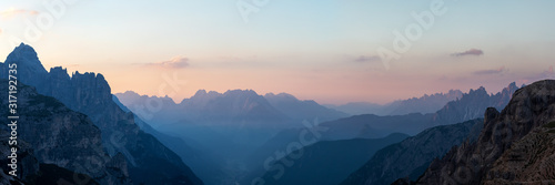 Looking South-East from the Three Peaks in the Dolomite Alps during sunrise, South Tyrol, Italy