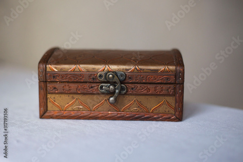 Wooden jewelry box with vintage lock.
