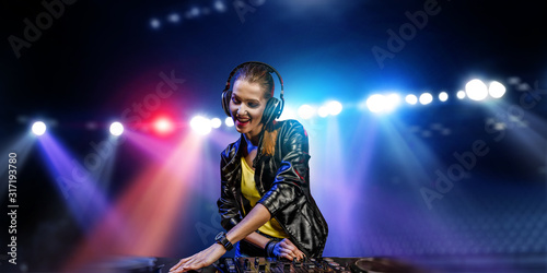 Female dj in nightclub. Mixed media © Sergey Nivens
