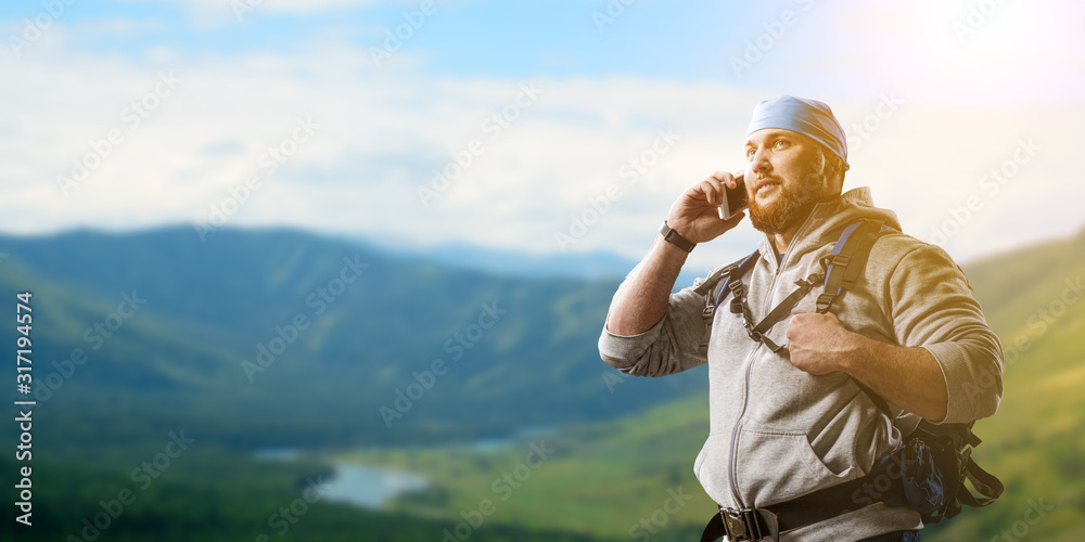 Hiker man in mountains. Mixed media Hiker man in mountains. Mixed media
