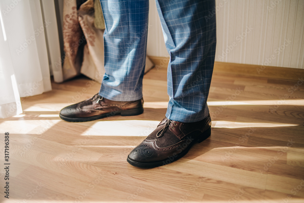 Men's shoes on the legs. Background for business card. Men's shoes on the legs. Background for business card.
