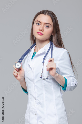 Portrait of a beautiful female doctor standing with stethoscope