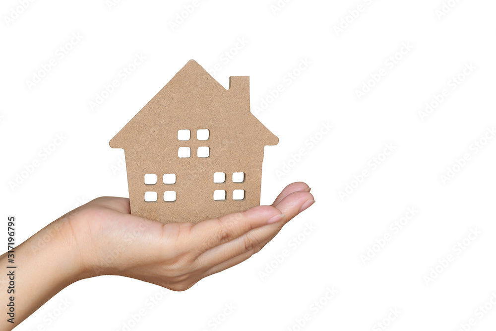 Savings money and real estate concept, Finance,Woman hand holding model house on white background Savings money and real estate concept, Finance,Woman hand holding model house on white background