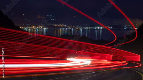 highway long exposure vehicle light trails curvy highway between mountains eilat israel	