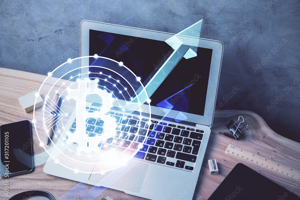 Double exposure of blockchain theme hologram and table with computer background. Concept of bitcoin crypto currency. Double exposure of blockchain theme hologram and table with computer background. Concept of bitcoin crypto currency.