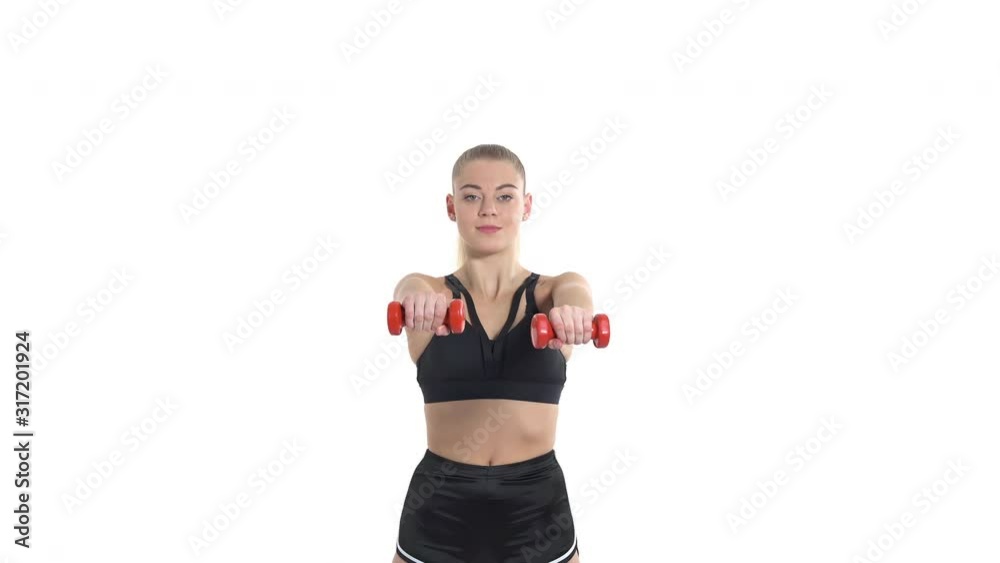 Close-up of sports woman performing exercises using dumbbells. Sport concept Close-up of sports woman performing exercises using dumbbells. Sport concept
