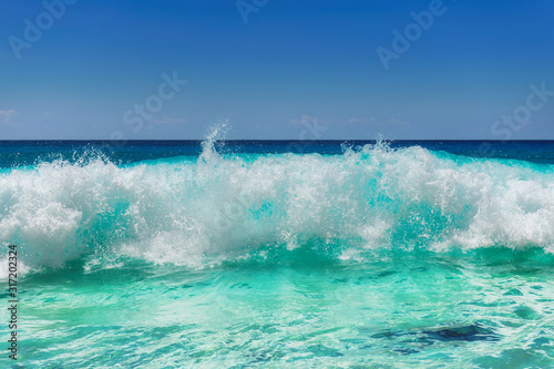 Turquoise sea wave beach background. Summer vacation and tropical beach concept.