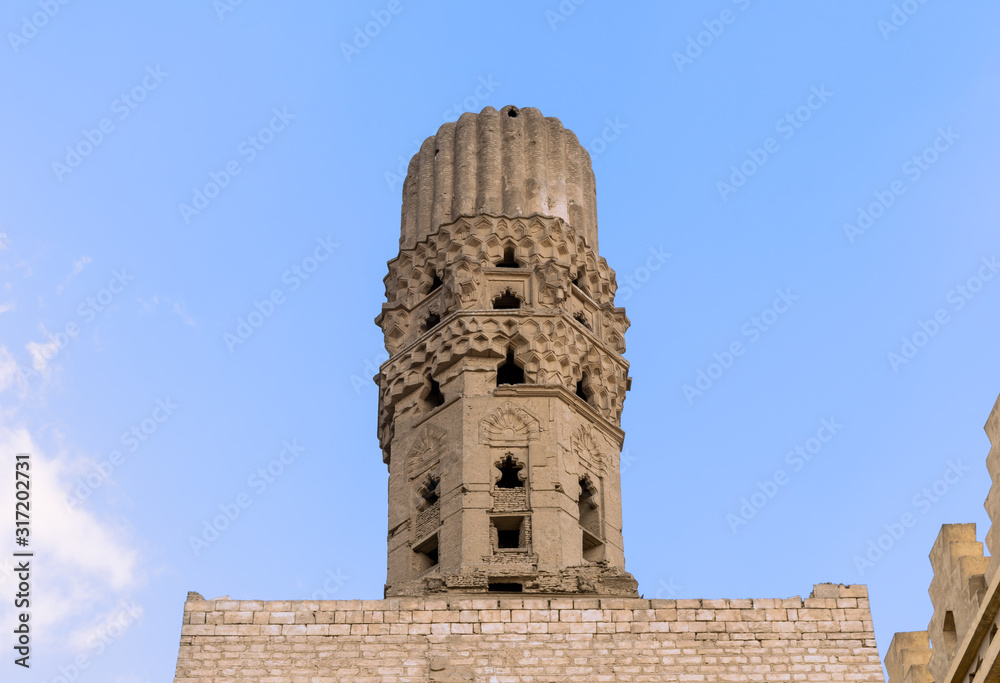 Minaret of public historic Al Hakim Mosque known as The Enlightened Mosque, located in Moez Street, Old Cairo, Egypt
