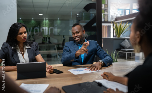 Black African businessman business strategy meeting in modern coworking workspace