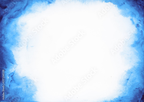 Abstract blue watercolor paint on white paper background
