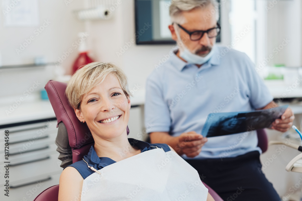 Smiling friendly woman patient in a dental surgery Smiling friendly woman patient in a dental surgery