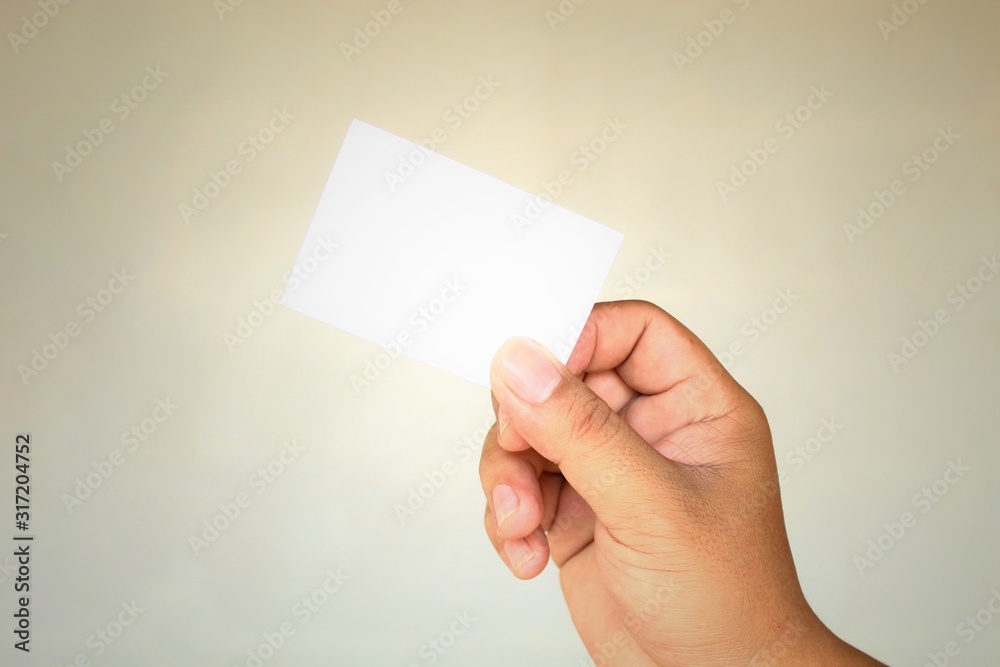 blank business card in hand isolated on white background blank business card in hand isolated on white background