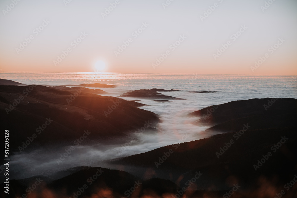First  Light in the Morning over ocean of Clouds 